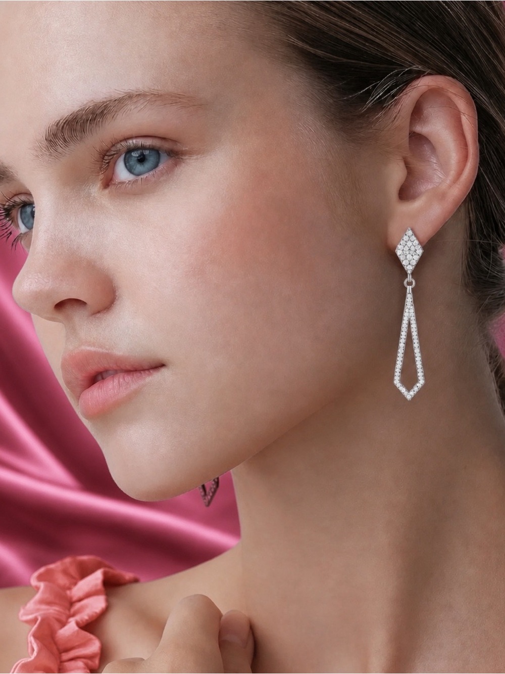 Moissanite drop earrings set in rhodium over 925 Sterling Silver.